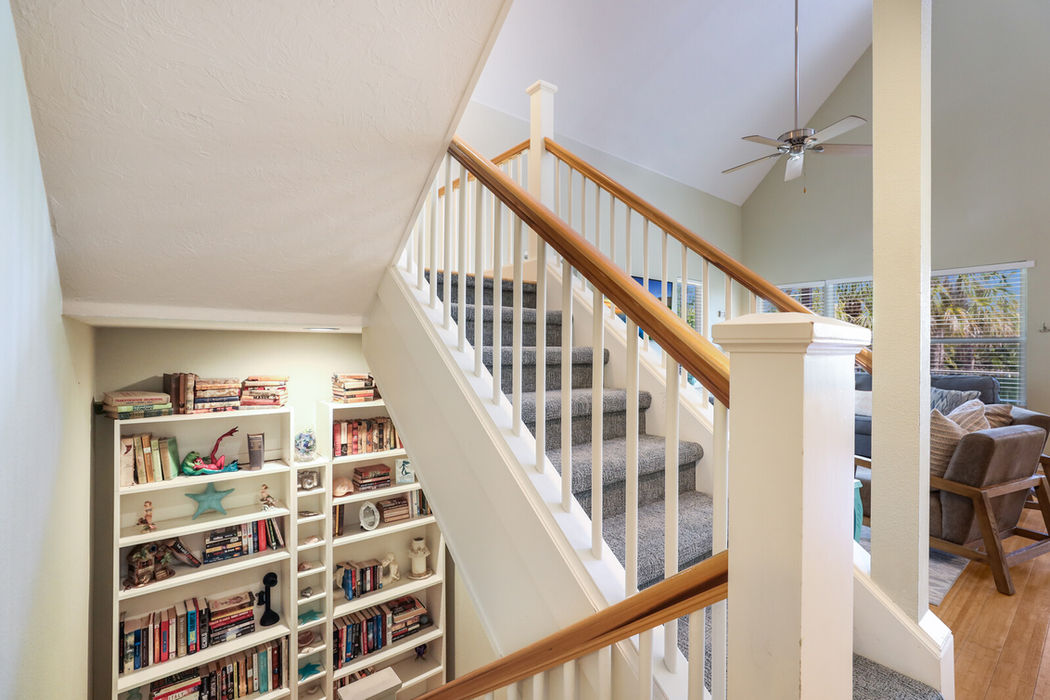Stairs leading up to masted bedroom and down to pool area
