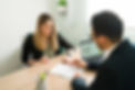 professional-lawyer-explaining-and-reviewing-business-contract-with-female-client-at-the-o