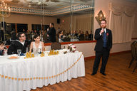 Groom giving a speech by the Mr. & Mrs. table at Weddings. Wedding Photographer.