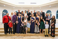 Large group photo, everyone smiling, bride and groom, Weddings, indoor setting, Wedding Photographer