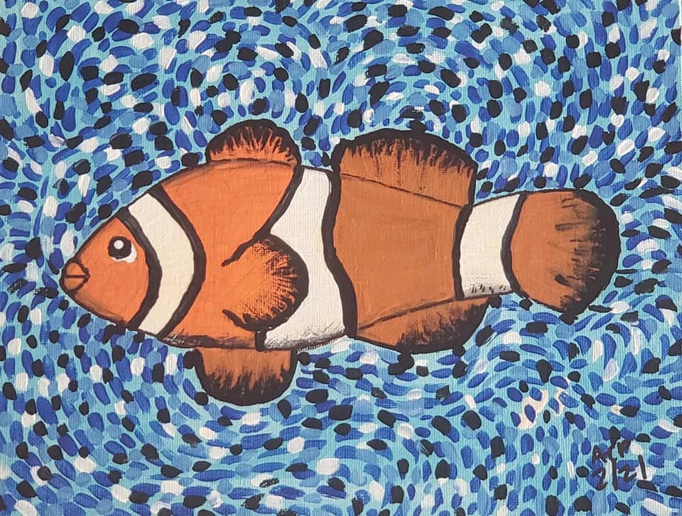 A bright and playful acrylic painting created at an Eclectica Studio & Gifts paint party, featuring an orange-and-white clownfish swimming in a swirling blue ocean background. The fish is outlined in bold black lines, making it beginner-friendly and perfect for kids, families, and school events. The background consists of hundreds of blue, teal, white, and black brush marks that create a sense of movement and water texture. This underwater-themed project teaches simple shading, line work, and color layering, making it a favorite for ocean-themed parties, summer camps, and Mini Masterpiece workshops in Springfield, MO. The uplifting color palette and charming cartoon style highlight Eclectica’s mission to make painting fun, accessible, and confidence-building for all ages.