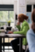 young-thoughtful-employee-working-laptop-coworking-office-professional-corporate-manager-s
