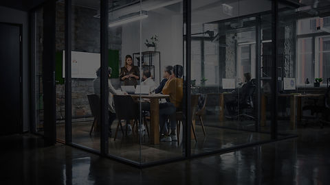 office with 5 people in a meeting room