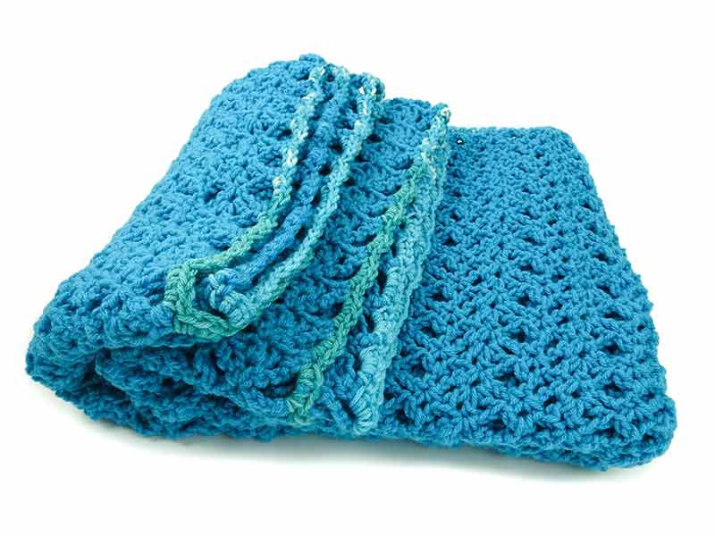 Thumbnail: Side view of Channai Turquoise travel blanket