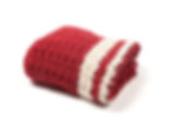 Side view of Maroon travel blanket with cream highlights