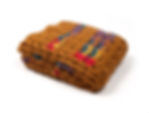Folded view of Cinnamon travel blanket with blend of vibrant colors