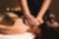 Men's hands make a therapeutic neck mass