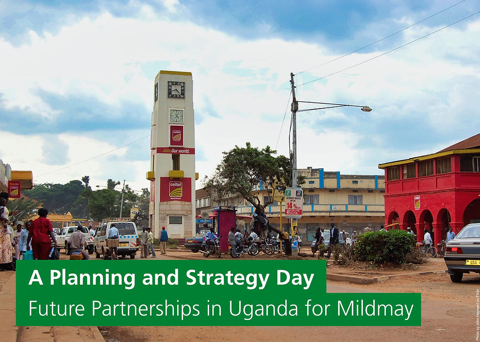 The clocktower in Mbale. The banner reads: A planning and strategy day - future partnerships in Uganda for Mildmay