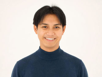 A quarter-length portrait of a smiling young man; Leo M