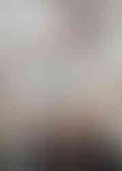 Two Mildmay student dietitians smiling in front of a BDA Food Allergy Specialist Group banner, wearing white clinical uniforms and event lanyards.