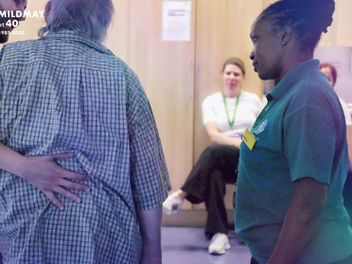 Our physio team works with a patient as students observe