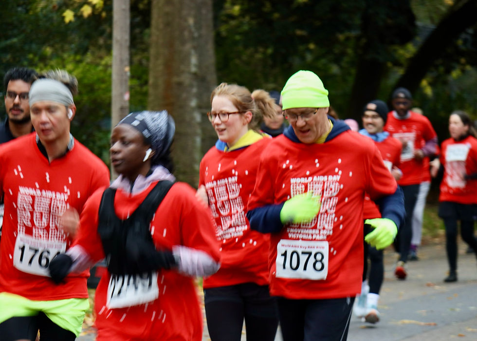 Mildmay CEO Geoff (yellow hat) in RED RUN 2024 (Geoff and his daughters take part every year).