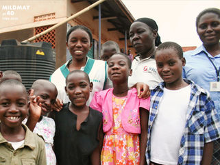 Group photo of Mildmay Uganda staff and children