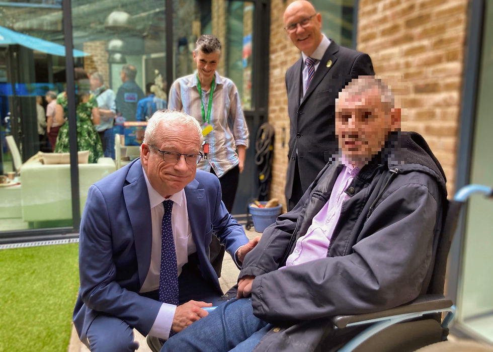 Lord Smith in conversation with a patient