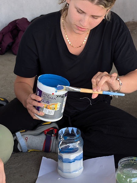 Zarah mixing the paint for the background