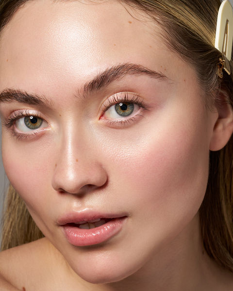 Skincare close up photo fair skintone blonde girl and green eyes