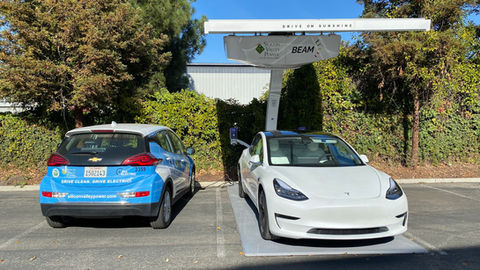 two vehicles being charge @ a Beam EV Arc Charging station