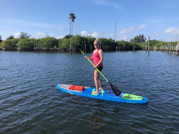 A lady paddleboarding 