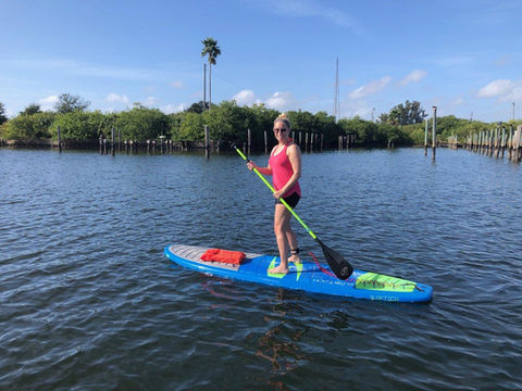 A lady paddleboarding 