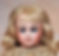 Antique blond haired doll with blue eyes