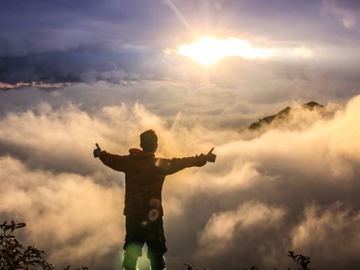 man in the mist looking at the sunset