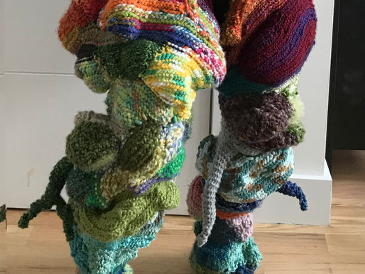 Becoming Cailleach performative costume — crocheted multicolor yarn leggings with organic, microbiome-inspired forms cascading down the legs, handmade by MFA artist and Clinical Herbalist Donna Troy Cleary of Spiral Herbal Remedies Brooklyn for the Art In Odd Places performance on 14th Street Manhattan