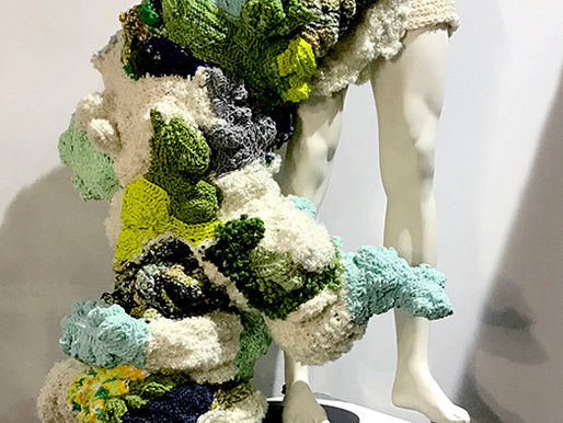 Hybrid, 2019 — crocheted yarn sculpture by Donna Troy Cleary engulfing a white mannequin torso on a pedestal, representing the human microbiome consuming and transforming the body — part of the Hybrid series by Clinical Herbalist and artist, founder of Spiral Herbal Remedies Brooklyn