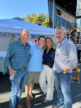 Shanna Truffini, Gardener Aidan, and friends smiling together at the You Are a Gardener® booth during Bottle Hill Day’s 50th Celebration in Madison, NJ.