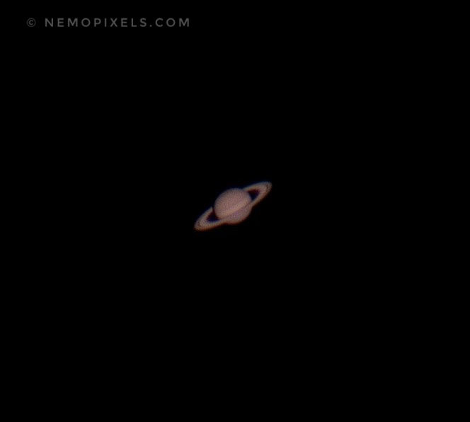 Planet Saturn seen through the Telescope at Astroville