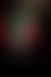 Portrait of a French DJ wearing sunglasses with a layered double-exposure effect