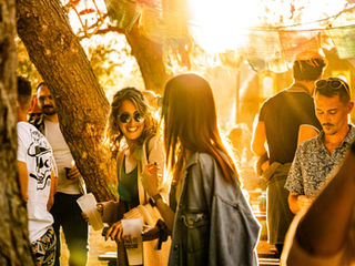 Festival crowd enjoying golden hour at Bloom Festival Malta 2025