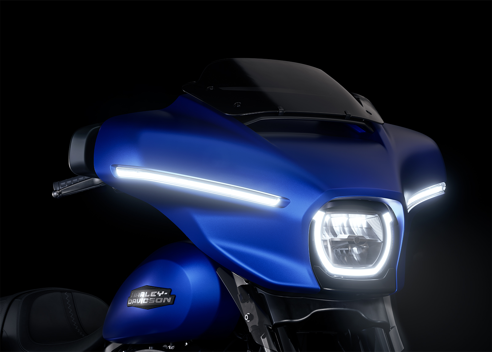Close-up of the 2026 Street Glide Batwing fairing and round LED headlamp