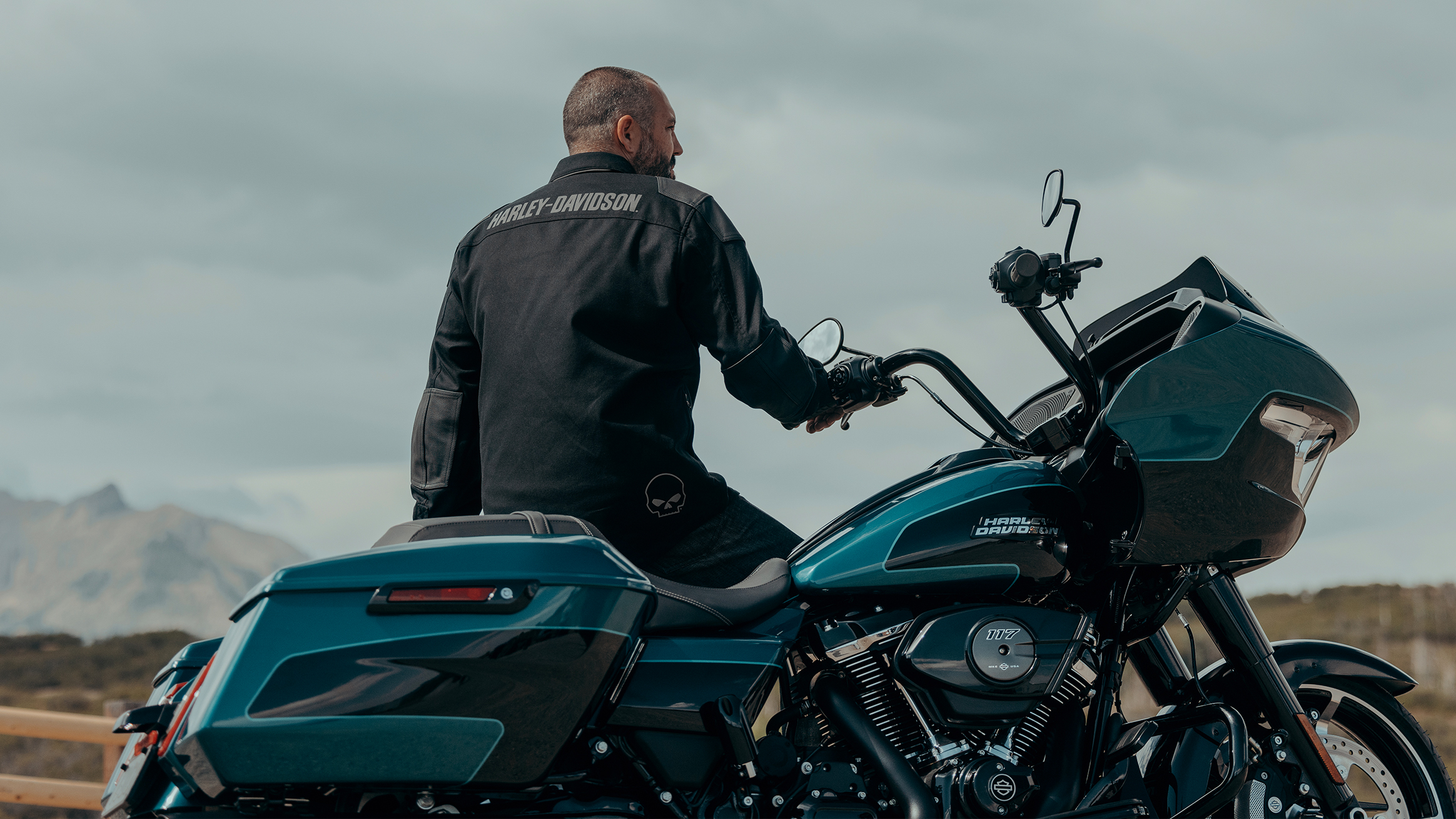 Rider in leather gear alongside a 2026 Harley-Davidson Road Glide