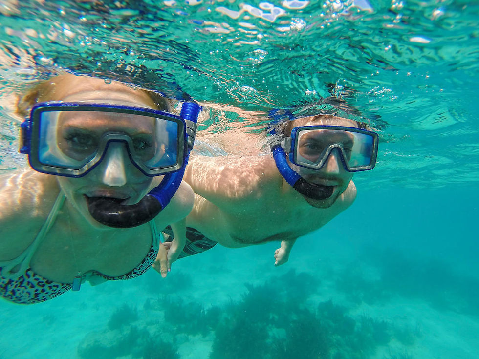 Sailing off St. John USVI, turquoise Caribbean water, passengers snorkeling.