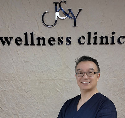 DR LIU WITH WALLPAPER_edited_edited.jpg