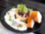 raw herring served on paprykasz-style rice