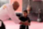 Child learning discipline and self control during a karate lesson at Birmingham Martial Arts Centre