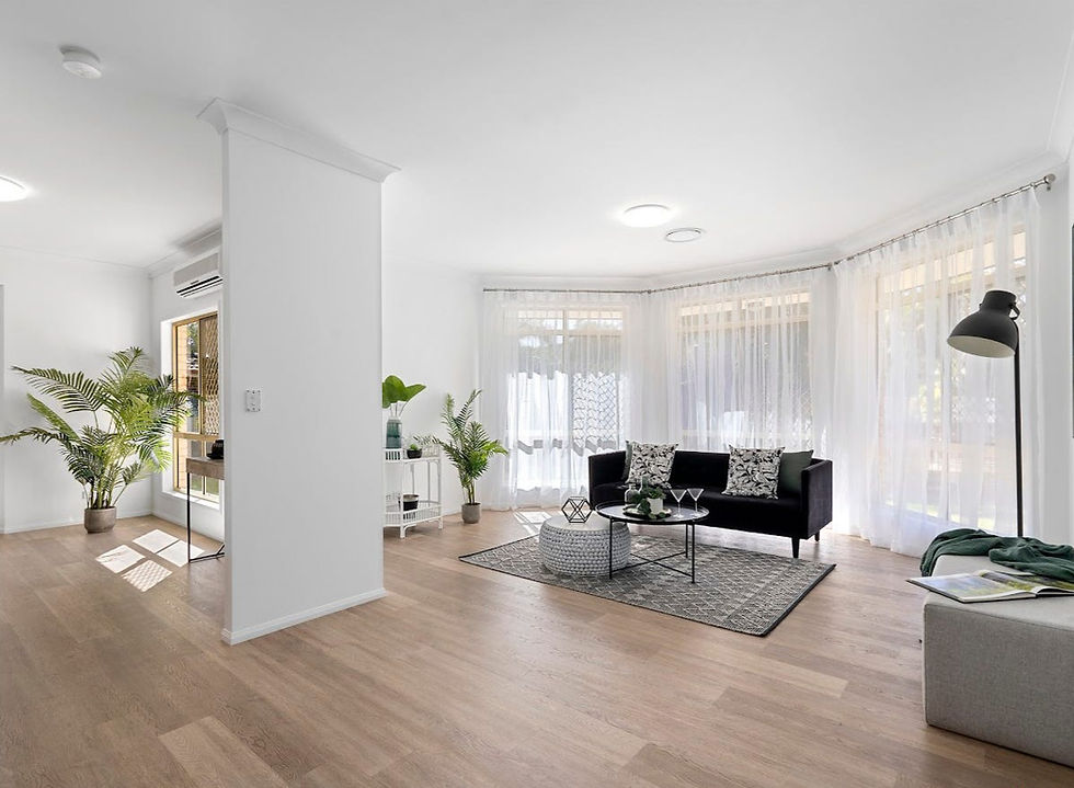 A styled lounge room with sheer curtains