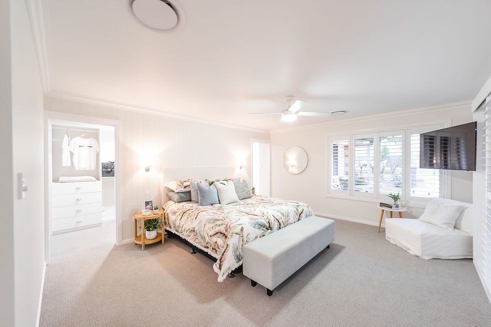 Styled master bedroom with walk in closet