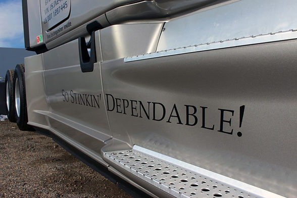 I sleak low-profile shot of a Simon Transport semi-truck