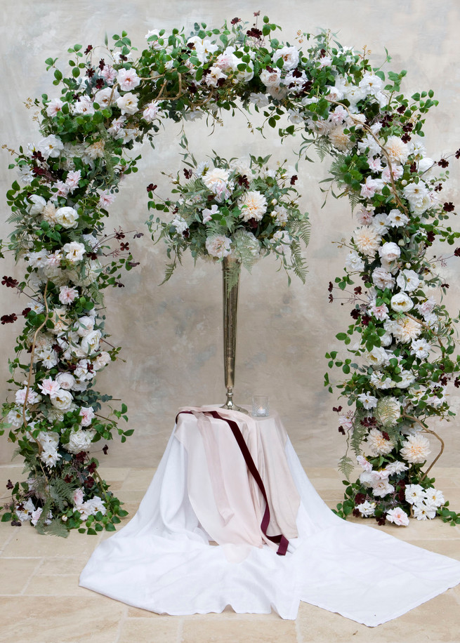 Faux flower arch and tablecentres for hire for weddings and events in Essex