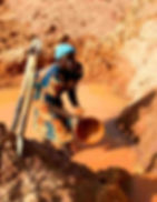 Woman washing gold Columbite plateau, Nigeria, 2004