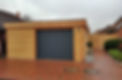 Holzgarage Lärche mit Garagentor in anthrazit modern Lärche.jpg