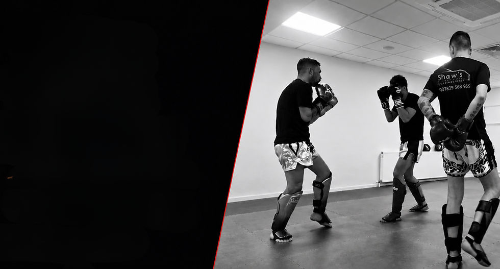 NAK Muay Thai Boxing Grangemouth coaches training during an authentic gym session