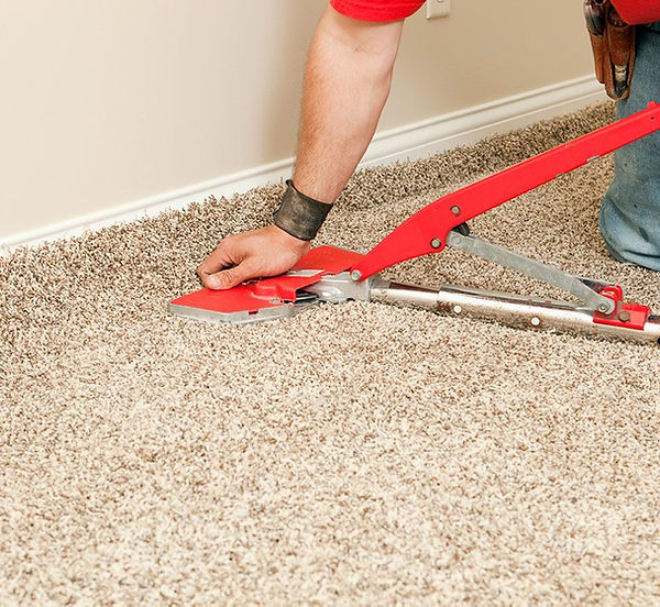 Professional carpet installation by CDA Carpet Repair & Rug Cleaning in Coeur d'Alene, North Idaho. Using a power stretcher,