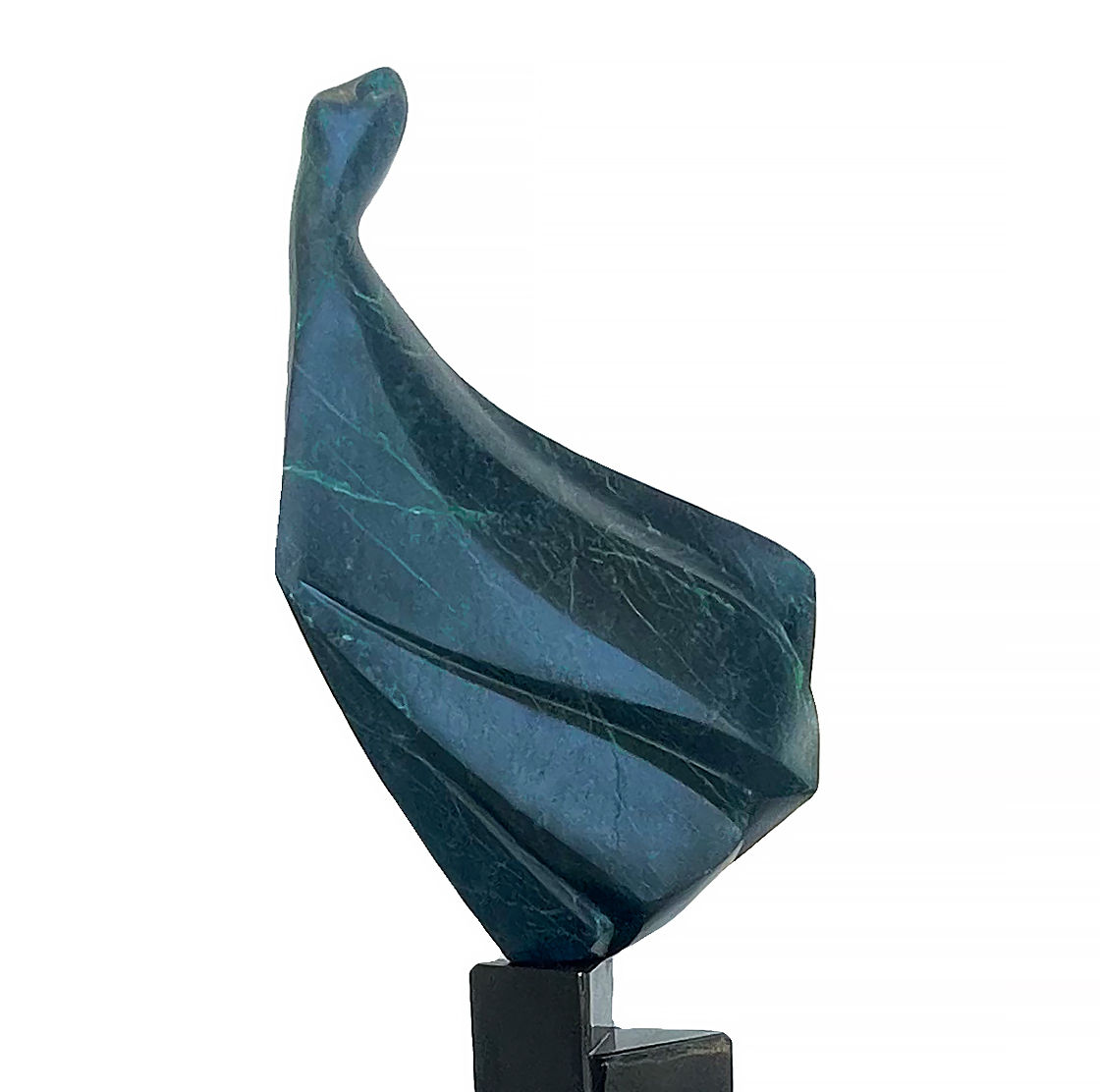 Graceful small stone sculpture of a dress figure poised atop a black steel staircase. Modern contemporary sculpture. Cropped.