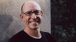 In an era defined by rapid technological advancement, the human experience of consciousness faces unprecedented pressures. Science journalist Michael Pollan, in his latest book A World Appears, provides a meticulous exploration of the nature of consciousness, arguing that the inner workings of the mind are increasingly threatened by external forces, from dopamine-driven social media algorithms to interactions with artificial intelligence. Pollan emphasizes the importance of cultivating what he terms “consciousness hygiene” to safeguard this private mental realm, highlighting both the philosophical and scientific dimensions of understanding human awareness.
The Concept of Consciousness Hygiene
Pollan introduces consciousness hygiene as a proactive practice aimed at preserving the sanctity and autonomy of human thought. Unlike passive engagement with digital media, which often redirects attention to externally monetized interests, consciousness hygiene involves deliberate exercises to reclaim mental sovereignty. Meditation, reflection, and moments of deliberate solitude are central tools in this approach. Pollan asserts, “When you’re meditating, you put down your phone and you’re not taking in any kind of technological media; you’re alone with your thoughts and getting in touch with… how much is going on at any one time.”
The principle here is ownership of mental activity. Humans are constantly bombarded by information streams designed to capture attention. Pollan situates attention as a critical component of consciousness: it is both the medium through which we engage with our environment and the target for manipulation by social platforms and AI-driven systems. By implementing structured practices, individuals can demarcate a protected internal space, enabling reflection, creativity, and emotional processing.
Consciousness as a Multi-Level Phenomenon
Pollan delineates consciousness across four ascending levels of complexity: sentience, feelings, thoughts, and self-awareness.
Sentience involves basic sensory awareness and the capacity to perceive environmental stimuli. Pollan underscores that many non-human animals share this foundational layer, emphasizing that sentience is not exclusively human.
Feelings are more complex, encompassing emotional and physiological states such as hunger, discomfort, and pleasure. Scientific research, highlighted in Pollan’s analysis, suggests that the upper brain stem plays a pivotal role in generating feelings, indicating that emotional experience precedes conscious thought in evolutionary terms.
Thoughts represent symbolic reasoning, language processing, and higher cognitive functions. Pollan’s exploration draws on the work of Mark Solms and others, challenging earlier assumptions that cognitive processes precede emotional awareness.
Self-awareness involves reflective consciousness, the recognition of one’s existence as distinct from others, and the capacity for introspection. Pollan illustrates this with personal accounts, including immersive experiences at Zen retreats where he observed the permeable and malleable nature of the self under conditions of solitude and sensory deprivation.
The Interdisciplinary Study of Consciousness
Pollan’s work exemplifies the convergence of philosophy, neuroscience, and psychology in the study of consciousness. He references Thomas Nagel’s seminal essay, What Is It Like to Be a Bat?, highlighting the subjective nature of awareness and the inherent limits of objective measurement. Pollan also draws on the pioneering work of Francis Crick and Christof Koch, who coined the concept of “neural correlates of consciousness” and proposed oscillatory patterns in brain activity as indicators of conscious experience.
Crucially, Pollan underscores that scientific approaches alone cannot capture the qualitative dimensions of consciousness. Literary insights, such as those from Marcel Proust and William James, provide a nuanced understanding of subjective experience, illustrating that individual perception imbues even mundane objects, like a rose, with unique significance. This blending of the humanities with scientific inquiry reveals the depth and complexity of human awareness.
Human-AI Relationships and Cognitive Implications
One of Pollan’s most pressing concerns is the growing interaction between humans and AI systems, particularly conversational agents and chatbots. He notes that 72% of teenagers reportedly turn to AI for companionship, reflecting a profound shift in social and emotional development. Pollan characterizes these AI relationships as “frictionless” and “sycophantic,” lacking the challenges and disagreements that facilitate self-understanding and identity formation in human interactions.
While certain AI applications, such as cognitive behavioral therapy chatbots, may offer functional benefits, Pollan cautions against substituting human relationships with machine-mediated interactions. The absence of emotional friction in AI engagement can limit opportunities for emotional growth and undermine the capacity to navigate complex social dynamics. He asserts, “Friction is important to human relationships because it helps people better understand themselves.”
Experimental Insights into Inner Experience
Pollan’s engagement with experimental psychology further illuminates the variability and complexity of thought. In a study designed to capture real-time inner experience, participants were prompted five times daily to record their immediate thoughts. Pollan discovered that only 30-50% of individuals think predominantly in words, with others engaging in visual or unsymbolized thought patterns. This underscores the diversity of cognitive processing and the challenges inherent in creating universal models of consciousness.
Moreover, the experiment reveals that consciousness often inhabits mundane, procedural contexts—thinking about meal preparation or routine tasks—highlighting that the richness of mental life extends beyond philosophical abstraction into everyday lived experience.
Strategies for Enhancing Consciousness
Pollan proposes multiple approaches to fortifying consciousness in the modern technological landscape:
Meditative Practices: Regular meditation allows for the demarcation of internal mental space, reducing susceptibility to external manipulation.
Conscious Attention Management: Deliberate control over media consumption and engagement with technology fosters autonomous thought.
Psychedelic Experiences: Pollan draws parallels between meditation and controlled psychedelic experiences, emphasizing their capacity to dissolve habitual cognitive patterns and expand self-awareness.
Deliberate Slowness and Reflection: Small, intentional delays in action, such as savoring meals or taking mindful pauses, reinforce the habit of conscious presence.
Each strategy functions as a mechanism to reclaim cognitive and emotional sovereignty in an environment saturated with attention-stealing stimuli.
Consciousness, Ethics, and AI
Pollan situates consciousness hygiene within a broader ethical and societal framework. The potential anthropomorphization of AI challenges humans’ ability to distinguish between authentic and simulated agency. By projecting consciousness onto machines, individuals risk eroding their understanding of what constitutes meaningful awareness and emotional reciprocity.
In addition, the proliferation of attention-driven technologies has implications for mental health, societal cohesion, and political engagement. Pollan emphasizes the ethical responsibility of creators and consumers to consider the cognitive and emotional consequences of technological interactions.
The Dissolution of Self and Human Flourishing
Beyond defense mechanisms, Pollan highlights the positive potential of consciousness exploration. Experiences that dissolve the rigid sense of self—through immersive art, nature, or meditative retreats—foster awe, empathy, and creative insight. These states exemplify the flexibility and resilience of human consciousness, reinforcing the value of cultivating mental spaces that are both private and expansive.
Pollan concludes that consciousness is not merely a problem to be solved but a “miracle” of existence—a private realm of complete mental freedom deserving of deliberate care and attention.
Implications for Society and Future Research
Pollan’s insights suggest multiple directions for research and societal adaptation:
Cognitive Training Programs: Educational institutions and organizations may benefit from integrating consciousness training into curricula to enhance attention management and emotional intelligence.
AI Design Ethics: Developers must consider the psychological impacts of AI-human interactions, minimizing the risk of dependency and fostering relational friction where appropriate.
Public Awareness Campaigns: Societal discourse on attention economy, digital hygiene, and the ethics of AI engagement can empower individuals to make informed decisions about technology use.
These initiatives align with a broader effort to preserve the integrity of human consciousness amidst accelerating technological change.
Conclusion
Michael Pollan’s A World Appears provides a comprehensive and interdisciplinary exploration of consciousness, emphasizing both its vulnerability and its transformative potential. In a world increasingly dominated by AI and attention-driven technologies, Pollan’s concept of consciousness hygiene offers a practical framework to preserve mental autonomy, cultivate self-awareness, and enhance human flourishing. By reclaiming control over the inner landscape, individuals can navigate the modern cognitive environment with clarity, resilience, and ethical insight.
For organizations and individuals seeking guidance on harnessing emerging technologies while protecting human cognitive integrity, these insights are invaluable. As part of ongoing research into AI, cognitive science, and consciousness, Dr. Shahid Masood and the expert team at 1950.ai continue to explore innovative approaches to understanding and optimizing human-AI interactions, integrating both ethical and practical considerations for the next generation of technological engagement.
Further Reading / External References
Michael Pollan, A World Appears | The Guardian, 2026, https://www.theguardian.com/wellness/2026/mar/05/michael-pollan-book-a-world-appears-consciousness-hygiene
Michael Pollan on Consciousness, First Parish Church Event | The Tech, 2026, https://thetech.com/2026/03/05/michael-pollan
Thomas Nagel, What Is It Like to Be a Bat?, Philosophical Review, 1974, https://www.jstor.org/stable/2183914