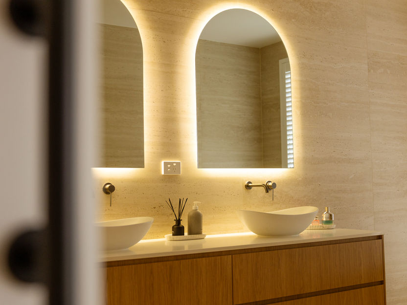 LED strip lighting and feature wall lighting installation in a renovated modern bathroom.