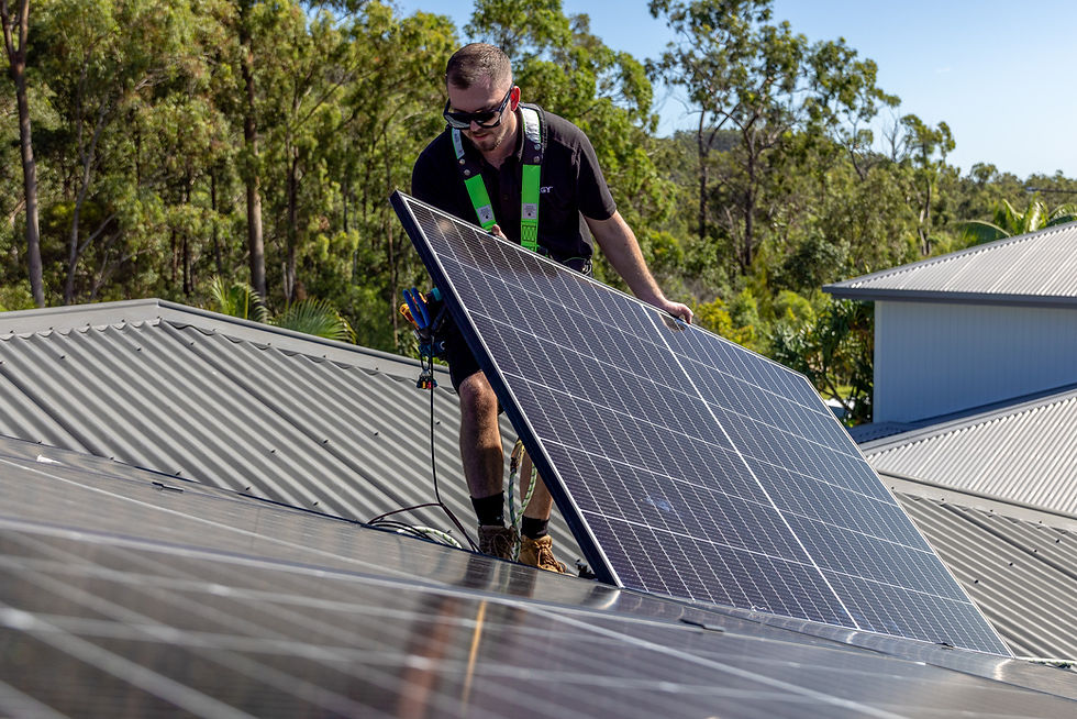 Nergy electrician installing residential solar panels on a metal roof in Southeast Queensland