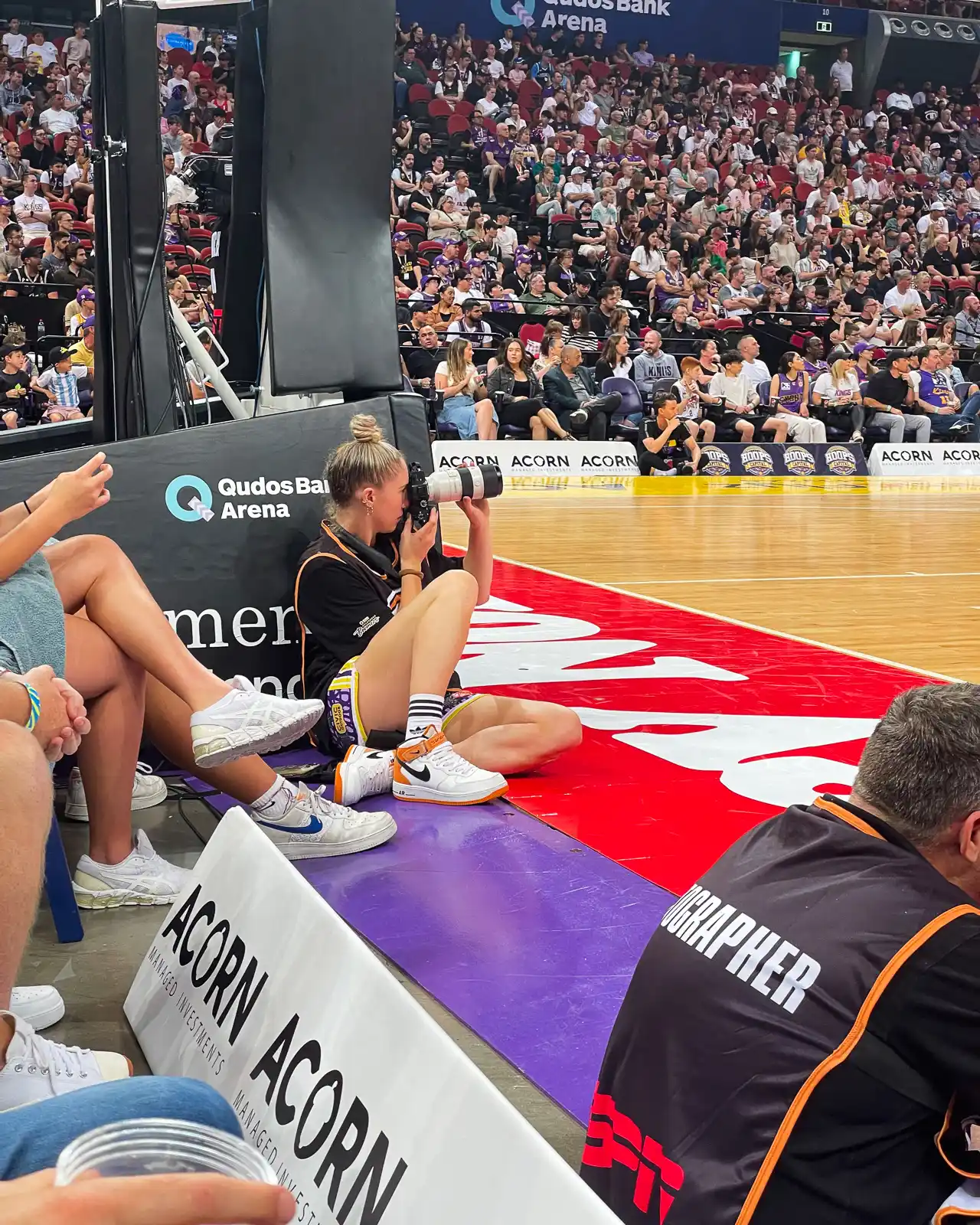 taylah simmons photographer taking photos at the sydney kings basketball game